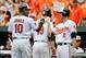 Jul 14, 2013; Baltimore, MD, USA; Baltimore Orioles center fielder Adam Jones (10) is congratulated by J.J. Hardy (2) after scoring on a two-run home run by Chris Davis (19) in the third inning against the Toronto Blue Jays at Oriole Park at Camden Yards.