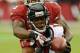 GLENDALE, AZ - OCTOBER 27: Darius Johnson #13 of the Atlanta Falcons attempts to make a catch while being defended by Jerraud Powers #25 of the Arizona Cardinals at University of Phoenix Stadium on October 27, 2013 in Glendale, Arizona. (Photo by Norm H