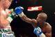 Sep 14, 2013; Las Vegas, NV, USA; Floyd Mayweather Jr. (blue gloves) and Canelo Alvarez battle it during their during their WBC and WBA super welterweight titles fight at MGM Grand Garden Arena. Mandatory Credit: Jayne Kamin-Oncea-USA TODAY Sports