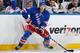 NEW YORK, NY - OCTOBER 31: Michael Del Zotto #4 of the New York Rangers skates with the puck against the Buffalo Sabres at Madison Square Garden on October 31, 2013 in New York City. (Photo by Scott Levy/NHLI via Getty Images)