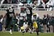 Nov 2, 2013; East Lansing, MI, USA; Michigan State Spartans quarterback Connor Cook (18) throws the ball away during the second quarter against the Michigan Wolverines at Spartan Stadium. Mandatory Credit: Raj Mehta-USA TODAY Sports