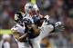 Nov 3, 2013; Foxborough, MA, USA; New England Patriots wide receiver Danny Amendola (80) pulls down a pass in front of Pittsburgh Steelers cornerback Ike Taylor (24) during the third quarter at Gillette Stadium. Mandatory Credit: Greg M. Cooper-USA TODAY