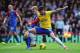LONDON, ENGLAND - OCTOBER 26: Olivier Giroud of Arsenal is challenged by Barry Bannan of Crystal Palace during the Barclays Premier League match between Crystal Palace and Arsenal at Selhurst Park on October 26, 2013 in London, England. (Photo by Shaun B
