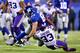 EAST RUTHERFORD, NJ - OCTOBER 21: Strong safety Jamarca Sanford #33 of the Minnesota Vikings tackles tight end Brandon Myers #83 of the New York Giants during a game at MetLife Stadium on October 21, 2013 in East Rutherford, New Jersey. (Photo by Al Bell