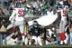 Oct 27, 2013; Philadelphia, PA, USA; New York Giants defensive tackle Linval Joseph (97) and defensive end Jason Pierre-Paul (90) react after sacking Philadelphia Eagles quarterback Matt Barkley (2) during the second half at Lincoln Financial Field. The G