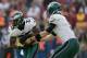 WASHINGTON, DC - NOVEMBER 18: Quarterback Nick Foles #9 of the Philadelphia Eagles hands the ball off to running back LeSean McCoy #25 during the first half against the Washington Redskins at FedEx Field on November 18, 2012 in Washington, DC. (Photo by