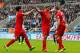 NEWCASTLE-UPON-TYNE, ENGLAND - OCTOBER 19: Steven Gerrard (C) of Liverpool celebrates after scoring his 100th Premier League goal and his team's first with team-mates Jordan Henderson (R) and Luis Suarez during the Barclays Premier League match between Ne