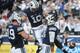 PROVO, UT - OCTOBER 12: Mitch Mathews #10 and Brett Thompson #19 of the Brigham Young Cougars celebrate with teammate Cody Hoffman #2 after his touchdown catch against the Georgia Tech Yellow Jackets at LaVell Edwards Stadium October 12, 2013 in Provo, U