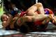 March 3, 2012; Columbus, OH, USA; Ronda Rousey gets Miesha Tate in an armbar during the Strikeforce Grand Prix final at Nationwide Arena. Mandatory Credit: Greg Bartram-USA TODAY Sports