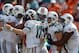 Sep 16, 2012; Miami Gardens, FL, USA; Miami Dolphins players Jonathan Martin (71), Ryan Tannehill (17), Jake Long (77), Anthony Fasano (80) and John Jerry (74) celebrate after a touchdown in the fourth quarter against the Oakland Raiders at Sun Life Stadi