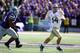 Oct 12, 2013; Manhattan, KS, USA; Baylor Bears quarterback Bryce Petty (14) is chased by Kansas State Wildcats defensive end Alauna Finau (94) during first-half action at Bill Snyder Family Stadium. Mandatory Credit: Scott Sewell-USA TODAY Sports