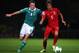 BELFAST, NORTHERN IRELAND - SEPTEMBER 06: Steven Davis of Northern ireland is tackled by Fabio Coentrao of Portugal during the FIFA 2014 World Cup Qualifying Group F match between Northern Ireland and Portugal at Windsor Park on September 6, 2013 in Bel