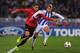 SAN SEBASTIAN, SPAIN - NOVEMBER 05: Chris Smalling of Manchester United battles with Antoine Griezmann of Real Sociedad during the UEFA Champions League Group A match between Real Sociedad and Manchester United at Estadio Anoeta on November 5, 2013 in Sa