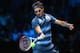 LONDON, ENGLAND - NOVEMBER 07: Roger Federer of Switzerland hits a forehand in his men's singles match against Richard Gasquet of France during day four of the Barclays ATP World Tour Finals at O2 Arena on November 7, 2013 in London, England. (Photo by