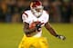 SOUTH BEND, IN - OCTOBER 19: Silas Redd #25 of the University of Southern California Trojans runs against the Notre Dame Fighting Irish at Notre Dame Stadium on October 19, 2013 in South Bend, Indiana. Notre Dame defeated USC 14-10. (Photo by Jonathan D