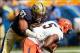 Sep 28, 2013; Pittsburgh, PA, USA; Pittsburgh Panthers defensive lineman Aaron Donald (97) sacks Virginia Cavaliers quarterback David Watford (5) during the second quarter at Heinz Field. Mandatory Credit: Howard Smith-USA TODAY Sports