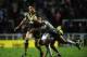 ST HELENS, ENGLAND - NOVEMBER 02: Greg Inglis of Australia tackled by Akuila Uate of Fiji during the Rugby League World Cup: Group A match between Australia and Fiji at Langtree Park on November 2, 2013 in St Helens, England. (Photo by Tony Marshall/Get