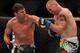 Apr 27, 2013; Newark, NJ, USA; Michael Bisping (red gloves) competes against Alan Belcher (blue gloves) during UFC 159 at the Prudential Center. Mandatory Credit: Brad Penner-USA TODAY Sports