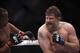 Oct 19, 2013; Houston, TX, USA; Daniel Cormier (red gloves) fights against Roy Nelson (blue gloves) in their heavyweight bout during UFC 166 at Toyota Center. Mandatory Credit: Andrew Richardson-USA TODAY Sports