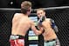 Dec 29, 2012; Las Vegas, NV, USA; Brad Pickett (left) and Eddie Wineland (right) exchange strikes during UFC 155 at the MGM Grand Garden Arena. Mandatory Credit: Gary A. Vasquez-USA TODAY Sports