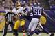 MINNEAPOLIS, MN - NOVEMBER 7: Kevin Williams #93 of the Minnesota Vikings sake Robert Griffin III #10 of the Washington Redskins during the third quarter of the game on November 7, 2013 at Mall of America Field at the Hubert H. Humphrey Metrodome in Minne