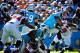 Powerful goal-line back Mike Tolbert reaches the end zone with help from LG Wharton and LT Gross.