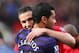 MANCHESTER, ENGLAND - NOVEMBER 03: Robin van Persie of Manchester United embraces Andre Santos of Arsenal prior to the Barclays Premier League match between Manchester United and Arsenal at Old Trafford on November 3, 2012 in Manchester, England. (Photo