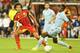 BRUSSELS, BELGIUM - AUGUST 14: Axel Witsel of Belgium plays the ball past Geoffrey Kondogbia during the International friendly match between Belgium and France at the King Baudouin Stadium on August 14, 2013 in Brussels, Belgium. (Photo by David Rogers/