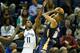 MEMPHIS, TN - NOVEMBER 06: Mike Conley #11 of the Memphis Grizzlies defends the shot on Eric Gordon #10 of the New Orleans Pelicans during the NBA game against the at FedExForum on November 6, 2013 in Memphis, Tennessee. NOTE TO USER: User expressly ack
