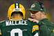 Nov 4, 2013; Green Bay, WI, USA; Green Bay Packers head coach Mike McCarthy talks with quarterback Seneca Wallace (9) during the first quarter against the Chicago Bears at Lambeau Field. Mandatory Credit: Jeff Hanisch-USA TODAY Sports