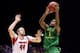 INDIANAPOLIS, IN - MARCH 29: Dominic Artis #1 of the Oregon Ducks drives for a shot attempt in the first half against Stephan Van Treese #44 of the Louisville Cardinals during the Midwest Region Semifinal round of the 2013 NCAA Men's Basketball Tournamen
