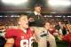 MIAMI, FL - JANUARY 03: Head coach Jim Harbaugh of the Stanford Cardinal celebrates as he is lifted up by his players including Zach Ertz #86 (L) after Stanford won 40-12 against the Virginia Tech Hokies during the 2011 Discover Orange Bowl at Sun Life S