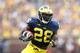 ANN ARBOR, MI - OCTOBER 05: Fitzgerald Toussaint #28 of the Michigan Wolverines runs eight yards for a first quarter touchdown during the game against the Minnesota Golden Gophers at Michigan Stadium on October 5, 2013 in Ann Arbor, Michigan. (Photo by