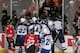 CHICAGO, IL - NOVEMBER 06: A fan (upper right) wears the helmet of Adam Pardy #2 of the Winnipeg Jets after pulling it off of his head after Pardy was checked through the glass by Brandon Bollig #52 of the Chicago Blackhawks at the United Center on Novemb