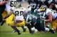 Nov 2, 2013; East Lansing, MI, USA; Michigan State Spartans linebacker Denicos Allen (28) tackles Michigan Wolverines running back Fitzgerald Toussaint (28) for a loss during the 1st half of a game at Spartan Stadium. Mandatory Credit: Mike Carter-USA TOD