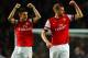 LONDON, ENGLAND - NOVEMBER 02: Laurent Koscielny of Arsenal and Per Mertesacker of Arsenal celebrate victory at the final whistle during the Barclays Premier League match between Arsenal and Liverpool at Emirates Stadium on November 2, 2013 in London, En