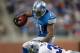 DETROIT, MI - OCTOBER 27: Reggie Bush #21 of the Detroit Lions tries to get around the tackle of Brandon Carr #39 of the Dallas Cowboys during a fourth quarter run at Ford Field on October 27, 2013 in Detroit, Michigan. Detroit won the game 31-30.(Photo b
