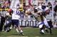 Oct 26, 2013; Orlando, FL, USA; UCF Knights defensive lineman E.J. Dunston (95) chases Connecticut Huskies quarterback Tim Boyle (14) in the second quarter at Bright House Networks Stadium. Mandatory Credit: David Manning-USA TODAY Sports