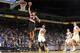 OAKLAND, CA - OCTOBER 24: Nicolas Batum #88 of the Portland Trail Blazers dunks against Kent Bazemore #20 of the Golden State Warriors on October 24, 2013 at Oracle Arena in Oakland, California. NOTE TO USER: User expressly acknowledges and agrees that, b