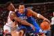 PHILADELPHIA, PA - NOVEMBER 2: Evan Turner #12 of the Philadelphia 76ers drives against Jimmy Butler #21 of the Chicago Bulls at the Wells Fargo Center on November 2, 2013 in Philadelphia, Pennsylvania. NOTE TO USER: User expressly acknowledges and agrees