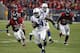 HOUSTON, TX - NOVEMBER 03: Trent Richardson #34 of the Indianapolis Colts rushes in the fourth quarter as he pursued by D.J. Swearinger #36 of the Houston Texans and Whitney Mercilus #59 at Reliant Stadium on November 3, 2013 in Houston, Texas. (Photo by
