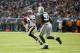 EAST RUTHERFORD, NJ - NOVEMBER 03: Drew Brees #9 of the New Orleans Saints in action against Calvin Pace #97 of the New York Jets during their game at MetLife Stadium on November 3, 2013 in East Rutherford, New Jersey. (Photo by Al Bello/Getty Images
