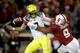 PALO ALTO, CA - NOVEMBER 07: Marcus Mariota #8 of the Oregon Ducks fumbles the ball when pressured by James Vaughters #9 of the Stanford Cardinal in the fourth period at Stanford Stadium on November 7, 2013 in Palo Alto, California. (Photo by Ezra Shaw/