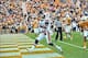 Nov 9, 2013; Knoxville, TN, USA; Auburn Tigers quarterback Nick Marshall (14) scores a touchdown against the Tennessee Volunteers during the first half at Neyland Stadium. Mandatory Credit: Jim Brown-USA TODAY Sports