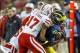 Nov 9, 2013; Ann Arbor, MI, USA; Nebraska Cornhuskers cornerback Ciante Evans (17) and safety Corey Cooper (6) tackle Michigan Wolverines tight end Jake Butt (88) in the third quarter at Michigan Stadium. Mandatory Credit: Rick Osentoski-USA TODAY Sports