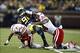 Nov 9, 2013; Ann Arbor, MI, USA; Michigan Wolverines quarterback Devin Gardner (98) is taken down by Nebraska Cornhuskers safety LeRoy Alexander (18) and defensive end Randy Gregory (44) in the second quarter at Michigan Stadium. Mandatory Credit: Rick Os