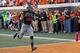 Nov. 9, 2013; Stillwater, OK, USA; Oklahoma State Cowboys running back Desmond Roland (26) catches a pass for a touchdown during the second quarter against the Kansas Jayhawks at Boone Pickens Stadium. Mandatory Credit: Richard Rowe-USA TODAY Sports