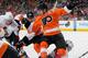 PHILADELPHIA, PA - APRIL 11: Claude Giroux #28 of the Philadelphia Flyers battles Colin Greening #14 of the Ottawa Senators for the puck on a face-off on April 11, 2013 at the Wells Fargo Center in Philadelphia, Pennsylvania. (Photo by Len Redkoles/NHLI