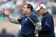 Nov 2, 2013; East Lansing, MI, USA; Michigan Wolverines head coach Brady Hoke (left) and defensive coordinator Greg Mattison (right) during the first quarter against the Michigan State Spartans at Spartan Stadium. The Spartans beat the Wolverines 29-6. Ma