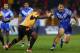 HULL, ENGLAND - NOVEMBER 04: Leeson Ah Mau (R) of Samoa fends off the challenge of Enoch Maki (L) of Papua New Guinea during the Rugby League World Cup Group B match between Papua New Guinea and Samoa at Craven Park Stadium on November 4, 2013 in Hull, E